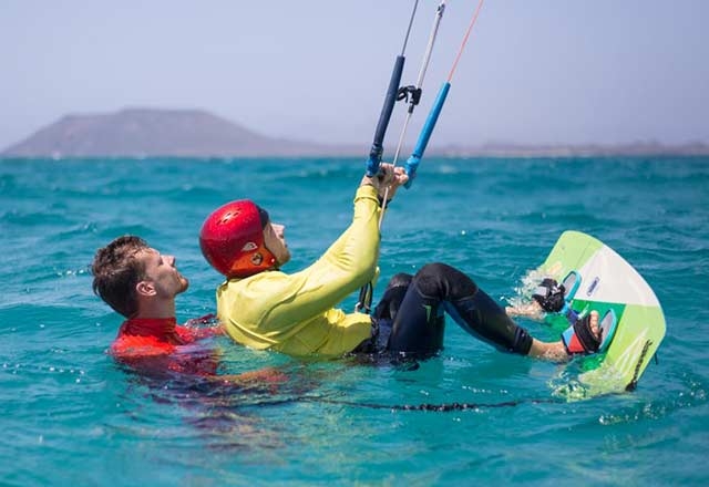 Man being taught how to kite surf